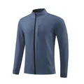 Detailed view of a blue men's athletic zip-up jacket with stand collar and chest pocket - M / Tops / Blue