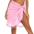 Close-up detail of a pink bohemian beach sarong wrap skirt featuring decorative tassel trim - One Size / Bottoms / Pink
