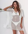 Close-up detail of a white loose-fit mesh beach cover-up worn by a female model. - One Size / White