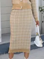 Detail view of a beige plaid knit midi skirt with matching cardigan and handbag. - S / Top And Bottom / Khaki