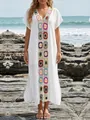Close-up detail of a white boho beach cover-up with colorful crochet flower patchwork. - One Size / Top And Bottom / White