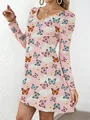 Detail view of women's V-neck A-line dress featuring vibrant butterfly and cloud print. - S / Tops / Butterfly Print