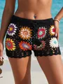 Detailed close-up of colorful handmade crochet floral granny square beach shorts for women - S / Bottoms / Black