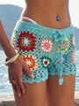 Detailed shot of handmade crochet granny square beach shorts in colorful boho style - Sky Blue