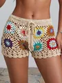 Detailed macro view of hand-crocheted granny square beach shorts with colorful floral patterns - S / Bottoms / Apricot
