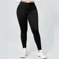 Dames legging in grote maten in zwart met hoge taille en slanke pasvorm op model - 1XL / Bottoms / Zwart
