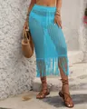 Detail view of a bright blue crochet beach skirt featuring long tassels and a drawstring waist. - S / Bottoms / Blue