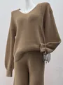 Detailed view of a brown V-neck knitted sweater and matching pants set for women - S / Tops / Camel