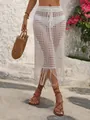 Close-up of white crochet beach cover-up skirt with hollow pattern and tassels - S / Bottoms / White