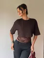 Detail shot of a stylish dark brown crop T-shirt with sheer lace paneling on the waist - Coffee
