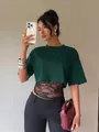 Detail shot of a stylish sexy green fake two-piece T-shirt with black lace patchwork. - Dark Green