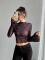 Stylish sheer black mesh long sleeve top with vibrant red heart print and flared sleeves - S / Tops / Black