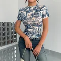 Elegant blue and white Toile de Jouy print mesh T-shirt with ruffle trim and slim fit design - S / Tops / Blue