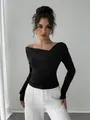 Elegant black slanted off-shoulder long sleeve top with draped neckline for a chic look - S / Tops / Black