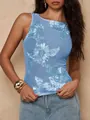 Close-up detail of light blue mesh top featuring heavy floral embroidery and a slim fashion fit - S / Tops / Teal