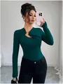 Detail of dark green slim fit top with asymmetrical cutout and gold metal ring. - S / Peacock Green