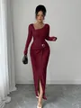Close-up showing the unique knitted texture and asymmetrical neckline of this burgundy long dress - S / Bottoms / Burgundy