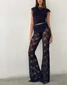 Detailed view of high-waist black lace flare pants with intricate floral patterns - S / Black