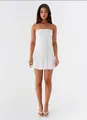 Front view of a chic white strapless backless pleated mini dress for women - S / White
