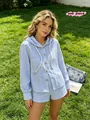 Casual blue and white striped hooded shirt and shorts set for a stylish beach vacation. - S / Tops / Sky Blue