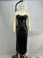 Detailed view of a black PU leather strapless pleated slim fit long dress on a mannequin - S / Tops / Black