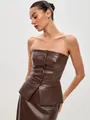 Close-up of brown PU leather strapless corset top featuring front button detail. - S / Tops / Camel