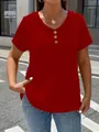 Close-up view of a women's red textured V-neck T-shirt featuring buttons and short sleeves. - S / Tops / Red