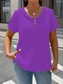 Close-up of women's purple textured V-neck T-shirt with decorative buttons. - Purple