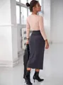 Detailed back view of a slim fit pink ribbed long sleeve top paired with a grey knit skirt. - S / Tops / Pink