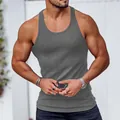 Detailed view of grey ribbed racerback tank top showing the slim fit on a muscular build - S / Tops / Dark Gray
