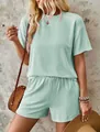 Detailed view of women's mint green ripple-textured two-piece set with shorts - Light Green