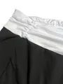 Detailed view of black and white spliced yoga pants with gathered waist seam - S / Bottoms / Black