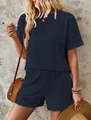 Detailed macro view of navy blue summer two-piece set featuring wavy texture fabric - Navy Blue