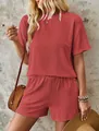 Close-up of women's terracotta ribbed two-piece set with short sleeve top and shorts - S / Top And Bottom / Red