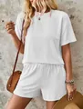 Close-up of white wavy textured two-piece set featuring short sleeve top and shorts - S / Top And Bottom / White