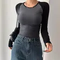 Close-up front view of a slim fit long sleeve raglan T-shirt in grey and black colors - S / Tops / Dark Gray