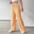 Dettaglio ravvicinato dei pantaloni a gamba dritta a scacchi arancioni e bianchi a vita alta - Taglia S / Pantaloni e gonne / Arancione