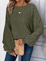 Detail view of olive green ribbed knit top featuring casual lantern sleeves and round neck - Dark Green