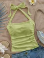 Textura detallada de la blusa halter verde lima con elegante lazo grande decorativo - S / Tops / Verde amarillento