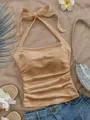 Elegante top halter beige con textura para el verano, mostrado en un estilo flat lay. - S / Tops / Caqui