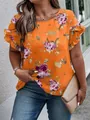 Detail of orange floral blouse featuring elegant ruffle sleeves and vibrant print. - XL / Tops / Orange