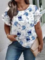 Close-up of elegant blue floral print and ruffled sleeves on white summer blouse - XL / Tops / Blue