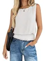 Detailed close-up of a white sleeveless top with a stylish smocked elastic waist hem. - S / Tops / White