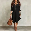 Detalle del dobladillo con volantes y mangas del vestido midi negro con cuello en V - S / Bottoms / Negro