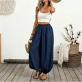 Detailed view of navy blue high-waisted lantern pants with flowy bohemian design - S / Bottoms / Navy Blue