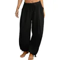 Detailed view of women's black loose jogger pants with elastic waist and cargo pockets. - S / Bottoms / Black