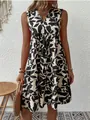 Casual Bohemian loose V-neck pleated dress with black floral print shown on a model - S / Top And Bottom / Black