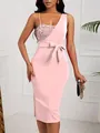 Detail view of a pink one-shoulder evening dress featuring sequins and a waist bow - XS / Top And Bottom / Pink
