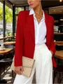 Close-up of a stylish red long-sleeved blazer in a chic outdoor cafe setting - S / Tops / Red