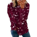 Close-up detail of women's burgundy long sleeve top featuring white graffiti splatter print - 3XL / Tops / Graffiti Wine Red